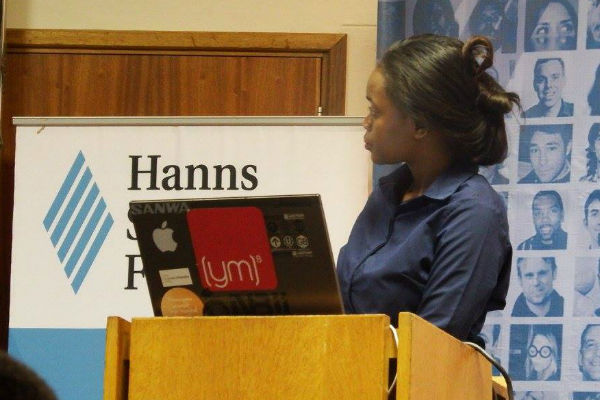 Daisry Mathias' assistant showing the Harambe Prosperity Plan